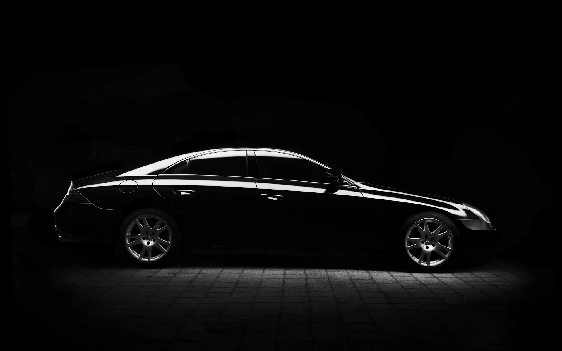Luxury car on an open road at dusk in Malaysia
